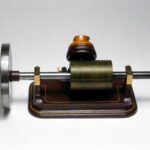 UNITED KINGDOM - JULY 30: Tinfoil phonograph made by the London Stereoscopic Company. Thomas Edison (1847-1931) invented sound recording in 1877. A sheet of tinfoil, moving under a needle attached to a diaphragm which vibrated in response to sound, became indented with a pattern which could be played back. Edison's first instrument had separate recording and reproducing diaphragms, but the model shown here has a single diaphragm for both functions. Also shown is the flywheel added by Edison to smooth out variations in speed inevitable with hand-turned machines. (Photo by SSPL/Getty Images)